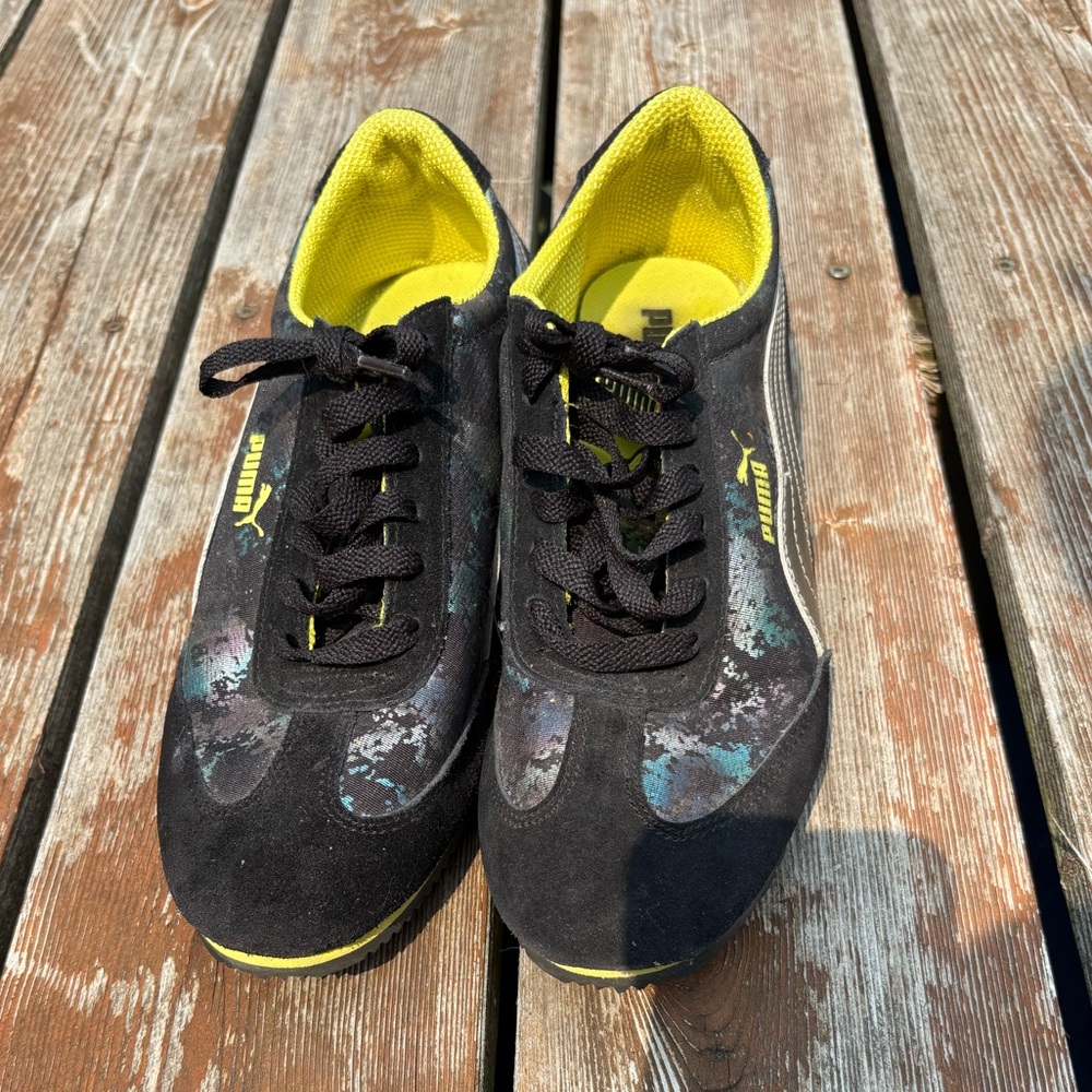 Puma Black Sneakers with silver, purple and teal details.